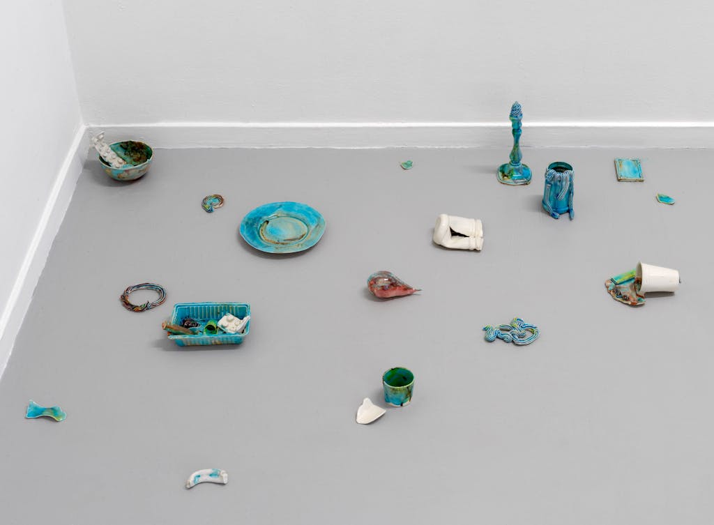 <p style="font-size:10px">Stéphanie Saadé, Space Habitability, 2021, 1360 grams of hand-glazed cast porcelain, dimensions and size of installation variable</p>

<p style="font-size:10px">Small porcelain pieces, with a weight equal to the artist’s pillow weight, are displayed on the ground. The porcelain pieces have been realized by Maastricht-based ceramic artist David Roosenberg.</p> - © Image courtesy by the artist and Grey Noise, Dubai.

Photo by: GJ.VanROOIJ, Paris Internationale