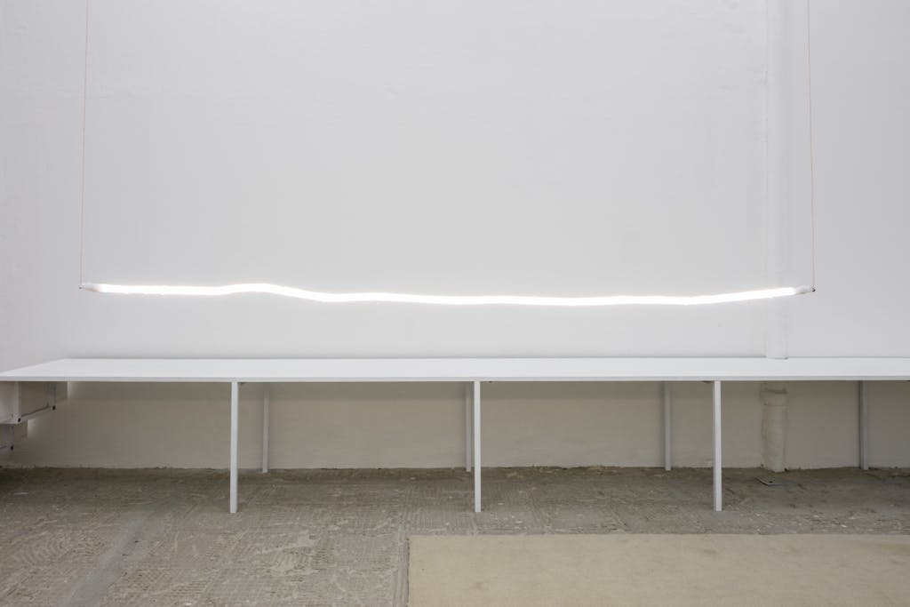 Charbel-joseph H. Boutros, Untitled until now, 2019 – 2021, neon, votive candle’s wax, light, 2.5x198 cm - © Image courtesy of the artist and Grey Noise, Dubai., Paris Internationale